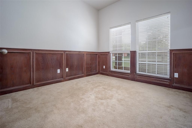 2400 Whiteoak Dr, Blanchard, OK 73010 - carpeted empty room with a wainscoted wall