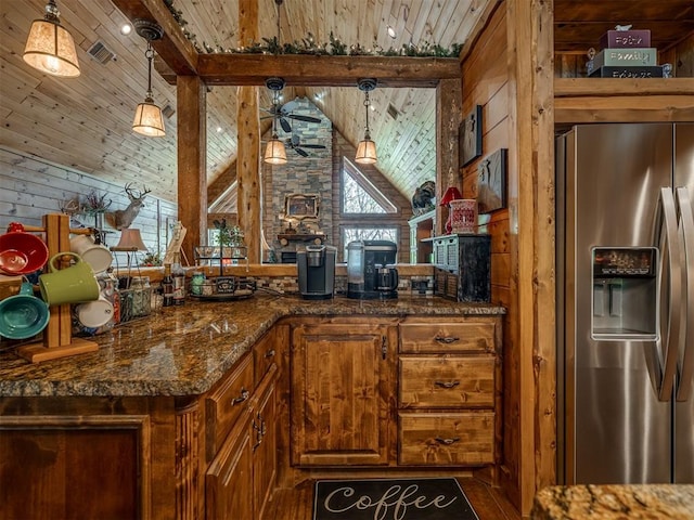 2010 Shady Cv, Sulphur, OK 73086 - kitchen featuring wood walls, vaulted ceiling with beams, wooden ceiling, stainless steel refrigerator with ice dispenser, and visible vents