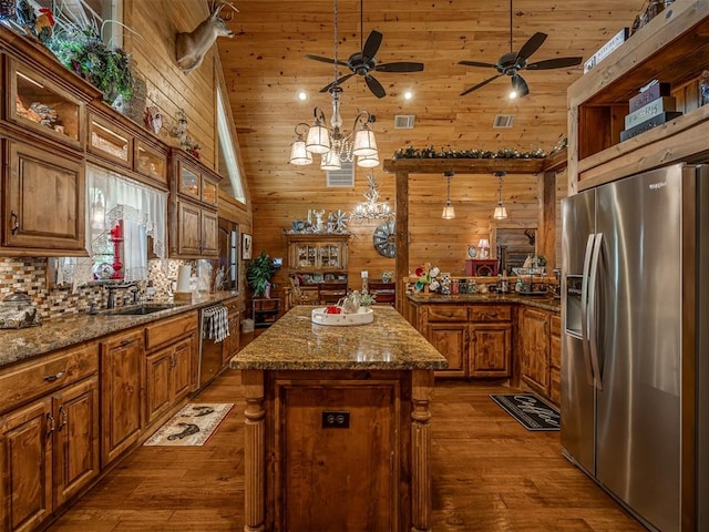 2010 Shady Cv, Sulphur, OK 73086 - kitchen featuring stainless steel appliances, a sink, visible vents, ceiling fan with notable chandelier, and brown cabinets