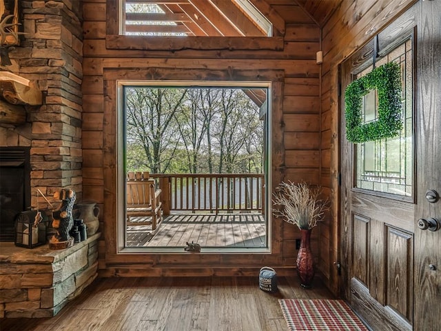 2010 Shady Cv, Sulphur, OK 73086 - doorway to outside with vaulted ceiling, plenty of natural light, and hardwood / wood-style floors
