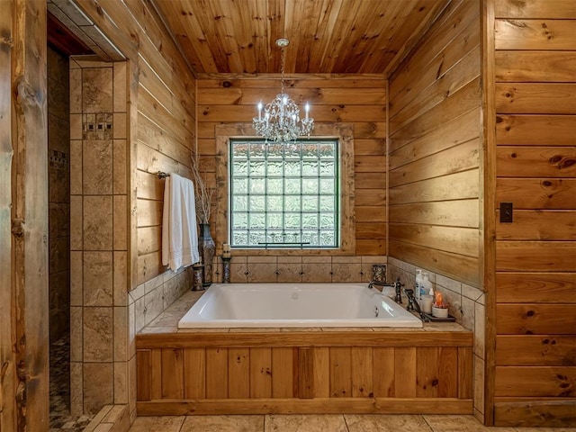 2010 Shady Cv, Sulphur, OK 73086 - full bathroom featuring a bath, wood ceiling, a chandelier, and wooden walls