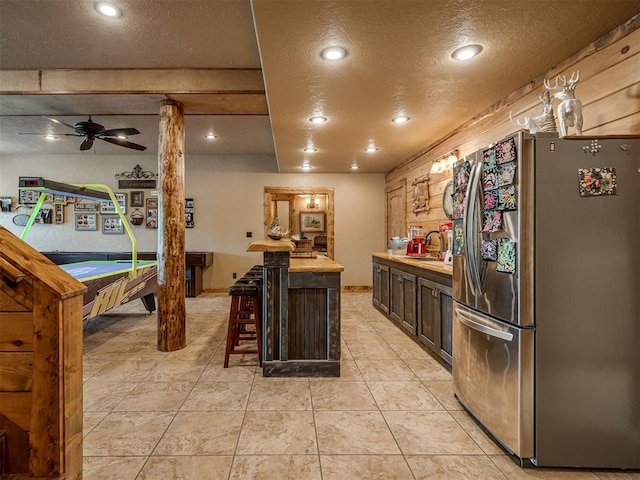 2010 Shady Cv, Sulphur, OK 73086 - kitchen featuring recessed lighting, freestanding refrigerator, a textured ceiling, and a sink