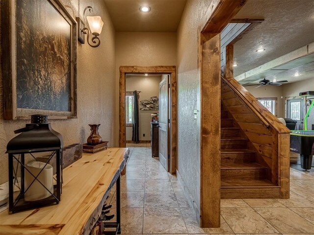 2010 Shady Cv, Sulphur, OK 73086 - stairway featuring recessed lighting, a textured wall, stone tile floors, and a ceiling fan