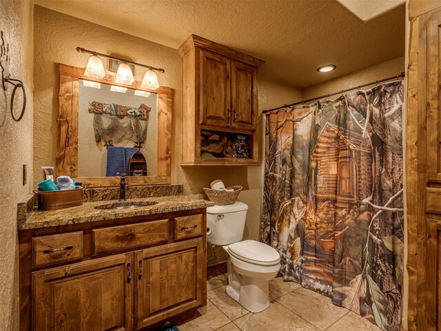 2010 Shady Cv, Sulphur, OK 73086 - bathroom with tile patterned flooring, a textured wall, a textured ceiling, and toilet