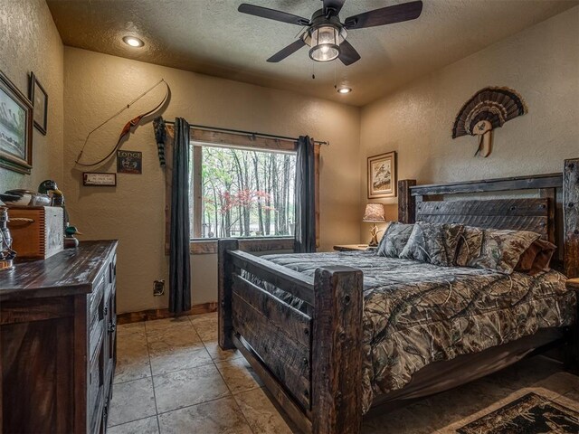 2010 Shady Cv, Sulphur, OK 73086 - bedroom featuring a textured wall, a textured ceiling, and ceiling fan