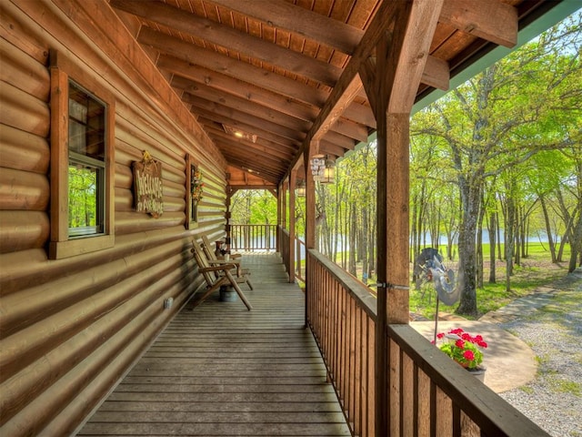 2010 Shady Cv, Sulphur, OK 73086 - wooden terrace with a water view and a porch