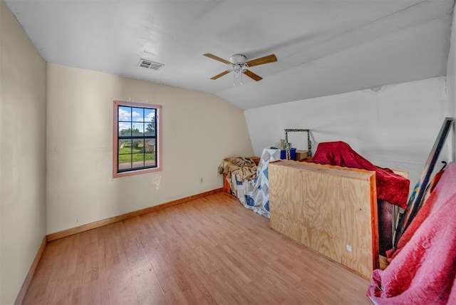 319 S Main St, Pocasset, OK 73079 - bedroom with lofted ceiling, wood finished floors, visible vents, baseboards, and ceiling fan