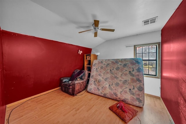 319 S Main St, Pocasset, OK 73079 - interior space featuring vaulted ceiling, baseboards, visible vents, wood finished floors, and ceiling fan