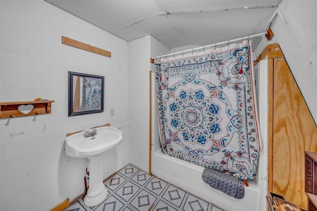 319 S Main St, Pocasset, OK 73079 - bathroom with shower / tub combo and tile patterned flooring
