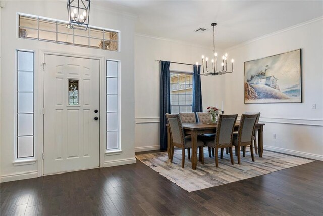 2201 Pine View Ter, Edmond, OK 73003 - dining area featuring a chandelier, wood finished floors, crown molding, and baseboards