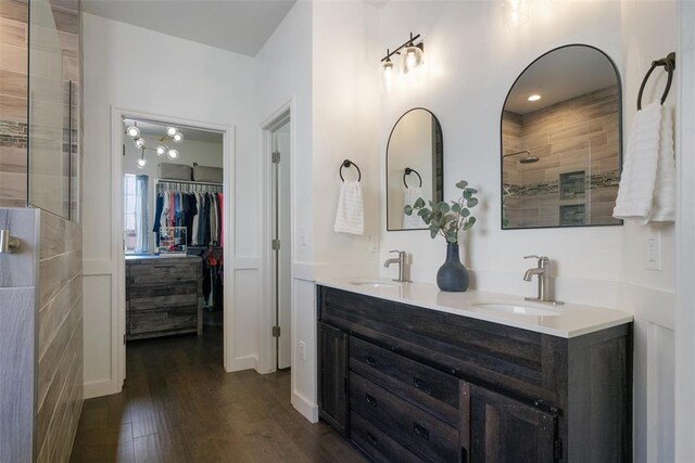 2201 Pine View Ter, Edmond, OK 73003 - full bathroom with double vanity, wood finished floors, and a spacious closet