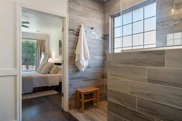 2201 Pine View Ter, Edmond, OK 73003 - bathroom featuring wood finished floors, ensuite bathroom, and walk in shower