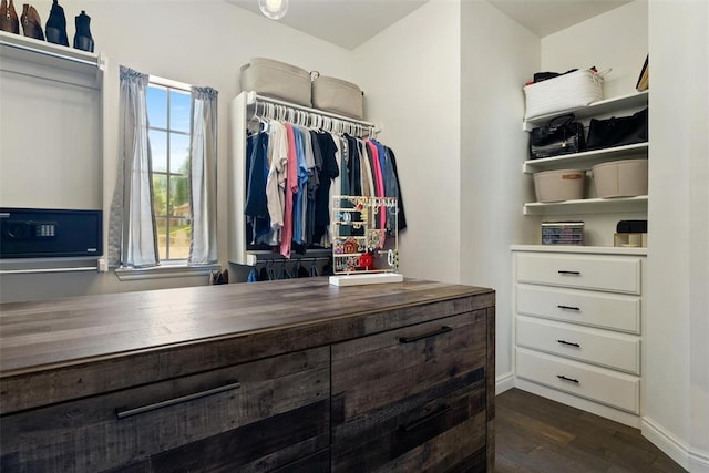 2201 Pine View Ter, Edmond, OK 73003 - walk in closet with dark wood finished floors