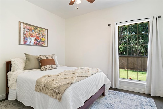 2201 Pine View Ter, Edmond, OK 73003 - bedroom with multiple windows, baseboards, and a ceiling fan