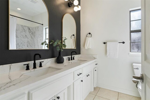 2201 Pine View Ter, Edmond, OK 73003 - bathroom with toilet, double vanity, tile patterned flooring, a shower with shower curtain, and baseboards