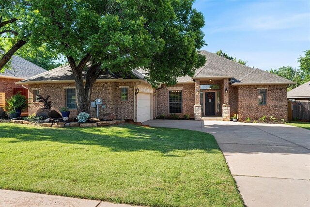 2201 Pine View Ter, Edmond, OK 73003 - view of front of home featuring concrete driveway, an attached garage, brick siding, and a shingled roof