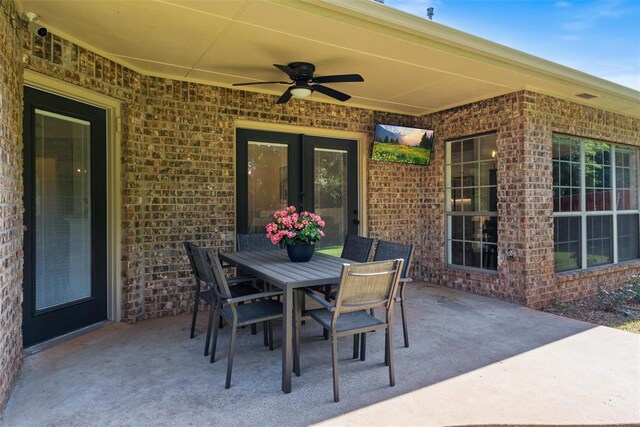 2201 Pine View Ter, Edmond, OK 73003 - view of patio featuring ceiling fan, outdoor dining area, and french doors