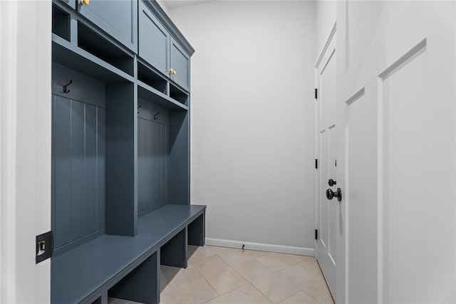 mudroom with baseboards and light tile patterned flooring