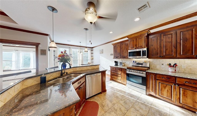 130 Quail Dr, Healdton, OK 73438 - kitchen with a sink, visible vents, a ceiling fan, appliances with stainless steel finishes, and ornamental molding