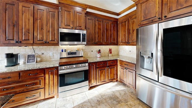 130 Quail Dr, Healdton, OK 73438 - kitchen featuring light stone countertops, stainless steel appliances, and backsplash