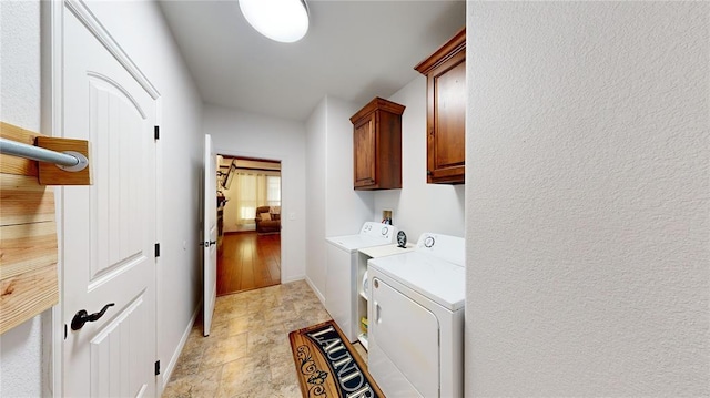 130 Quail Dr, Healdton, OK 73438 - laundry area with baseboards, cabinet space, and independent washer and dryer