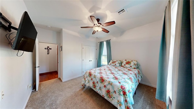 130 Quail Dr, Healdton, OK 73438 - bedroom with a closet, ceiling fan, light colored carpet, baseboards, and visible vents