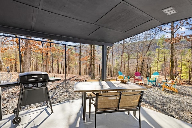 30953 State Hwy Unit 144, Smithville, OK 74957 - view of patio with outdoor dining space, a grill, and a view of trees