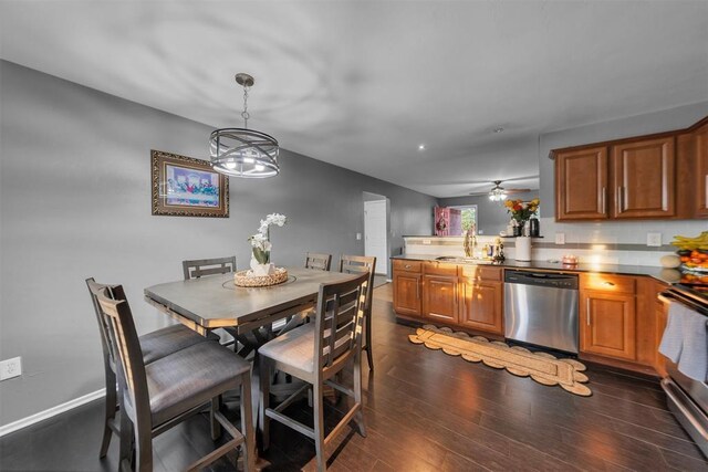 7909 Chumley Ln, Oklahoma City, OK 73135 - dining room with ceiling fan and dark wood-style floors