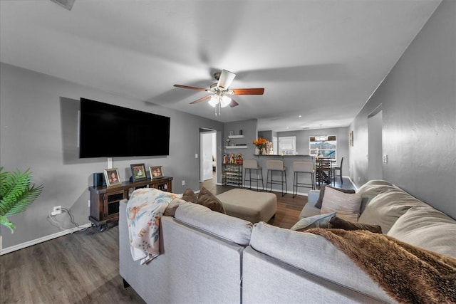 7909 Chumley Ln, Oklahoma City, OK 73135 - living room featuring baseboards, ceiling fan, and wood finished floors