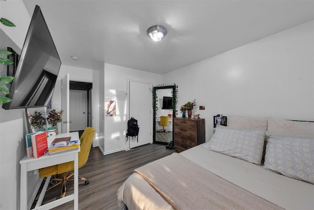 7909 Chumley Ln, Oklahoma City, OK 73135 - bedroom featuring wood finished floors