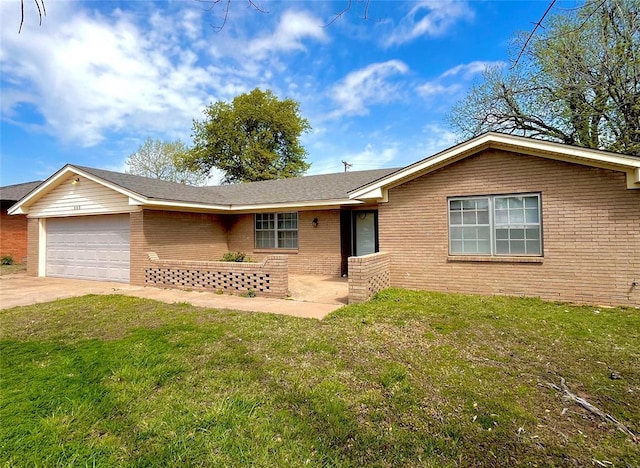 503 Kingston Dr, Yukon, OK 73099 - single story home featuring concrete driveway, brick siding, a front yard, and a garage