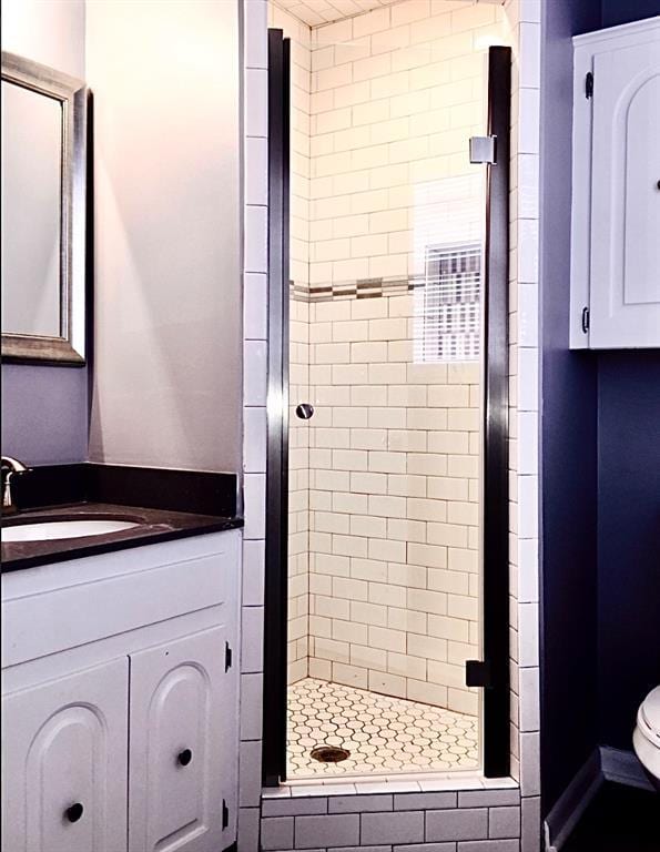 503 Kingston Dr, Yukon, OK 73099 - bathroom with a shower stall, toilet, and vanity