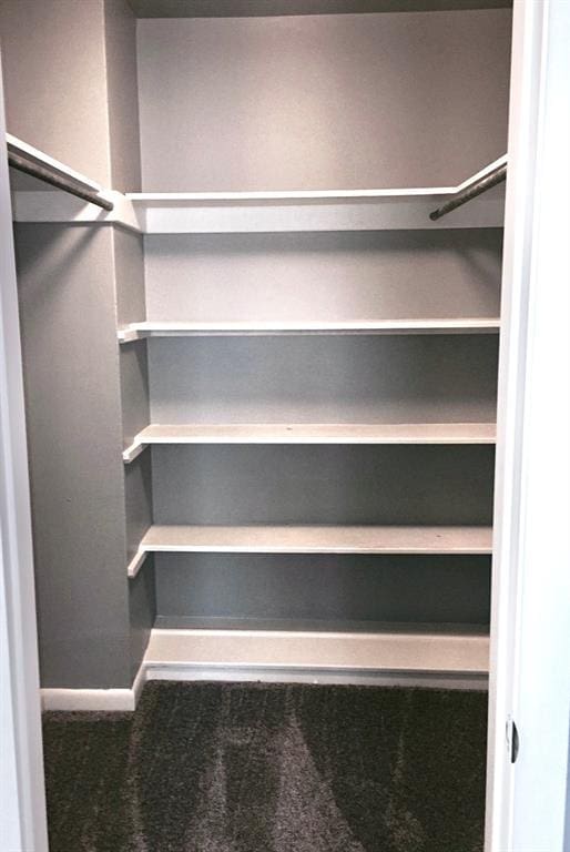 503 Kingston Dr, Yukon, OK 73099 - walk in closet featuring carpet