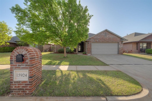 15924 Sky Run Dr, Edmond, OK 73013 - view of front of property with an attached garage, a front lawn, brick siding, and concrete driveway