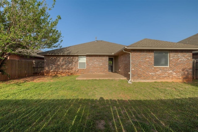 15924 Sky Run Dr, Edmond, OK 73013 - rear view of property featuring a patio area, fence, and a yard