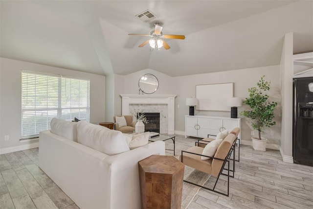 15924 Sky Run Dr, Edmond, OK 73013 - living room with ceiling fan, vaulted ceiling, light wood-type flooring, and visible vents