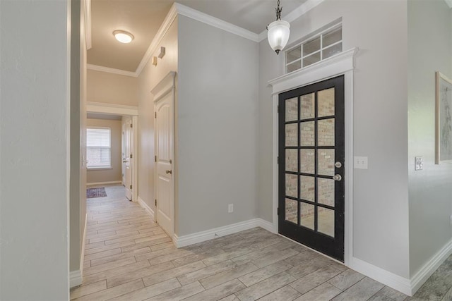 15924 Sky Run Dr, Edmond, OK 73013 - foyer featuring crown molding, baseboards, and wood finished floors
