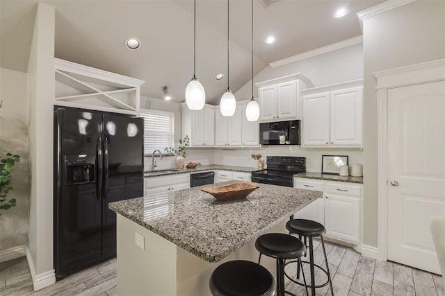 15924 Sky Run Dr, Edmond, OK 73013 - kitchen with light stone counters, wood tiled floor, backsplash, and black appliances