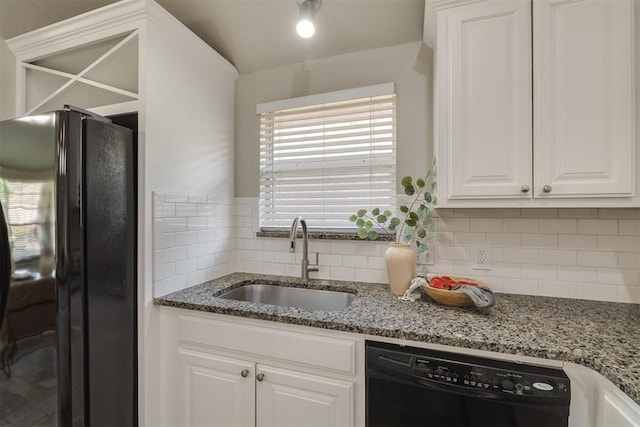 15924 Sky Run Dr, Edmond, OK 73013 - kitchen featuring white cabinets, a sink, stone counters, backsplash, and black appliances