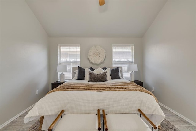 15924 Sky Run Dr, Edmond, OK 73013 - bedroom with a ceiling fan, baseboards, vaulted ceiling, and light wood-style floors