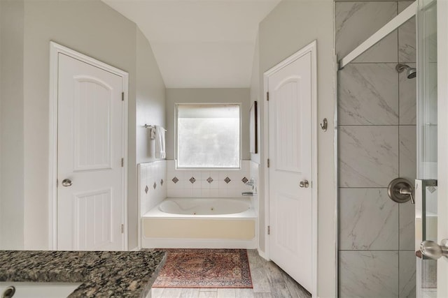 15924 Sky Run Dr, Edmond, OK 73013 - bathroom with a stall shower, a bath, and lofted ceiling
