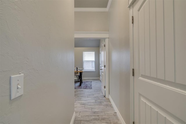 15924 Sky Run Dr, Edmond, OK 73013 - corridor featuring a textured wall, baseboards, ornamental molding, and light wood finished floors