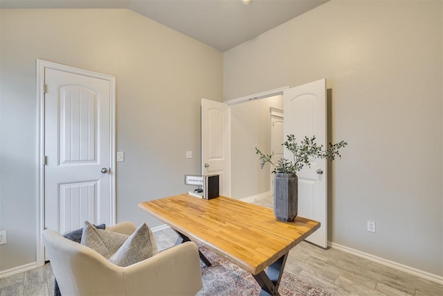 15924 Sky Run Dr, Edmond, OK 73013 - office area featuring baseboards, vaulted ceiling, and light wood finished floors
