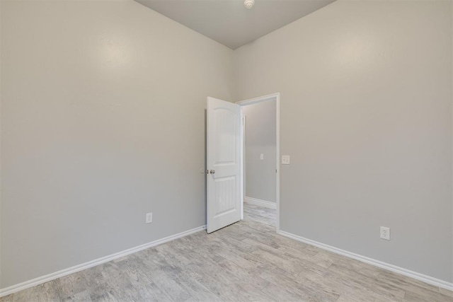 15924 Sky Run Dr, Edmond, OK 73013 - empty room with light wood-type flooring and baseboards