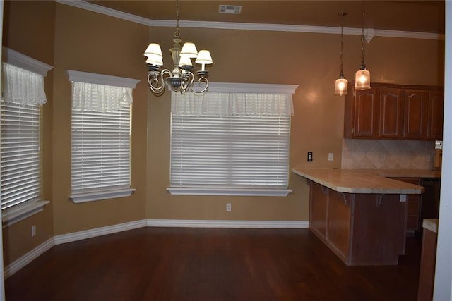 2297 Barrington Dr, Blanchard, OK 73010 - kitchen featuring tasteful backsplash, an inviting chandelier, baseboards, dark wood-type flooring, and visible vents