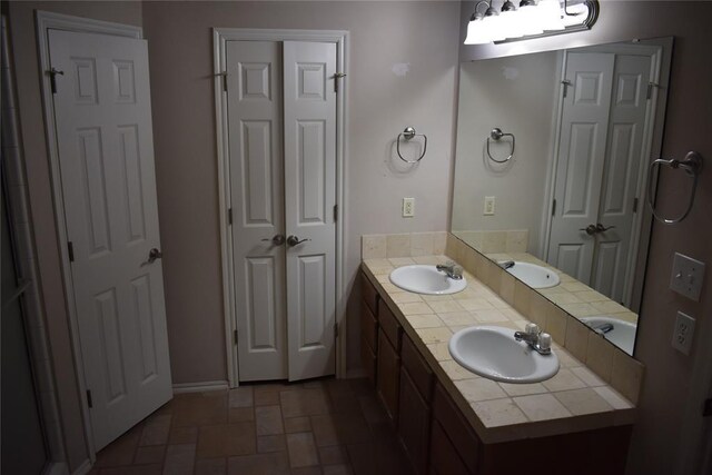 2297 Barrington Dr, Blanchard, OK 73010 - full bathroom with stone finish flooring, a sink, and double vanity