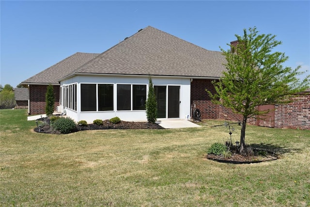 2297 Barrington Dr, Blanchard, OK 73010 - rear view of property featuring brick siding, a yard, and a shingled roof