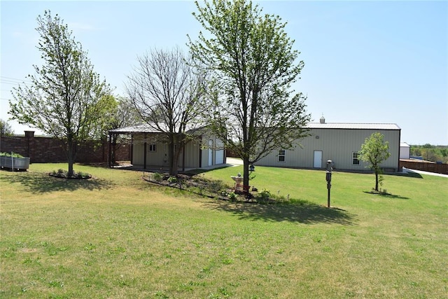 2297 Barrington Dr, Blanchard, OK 73010 - view of yard featuring fence, an outdoor structure, an outbuilding, and a garage