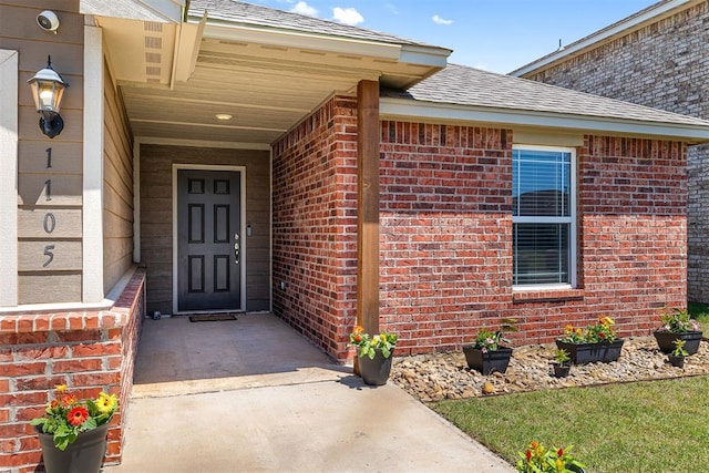 1105 NW 3rd St, Newcastle, OK 73065 - property entrance featuring roof with shingles and brick siding