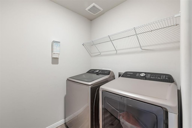 1105 NW 3rd St, Newcastle, OK 73065 - laundry room featuring separate washer and dryer, laundry area, visible vents, and baseboards